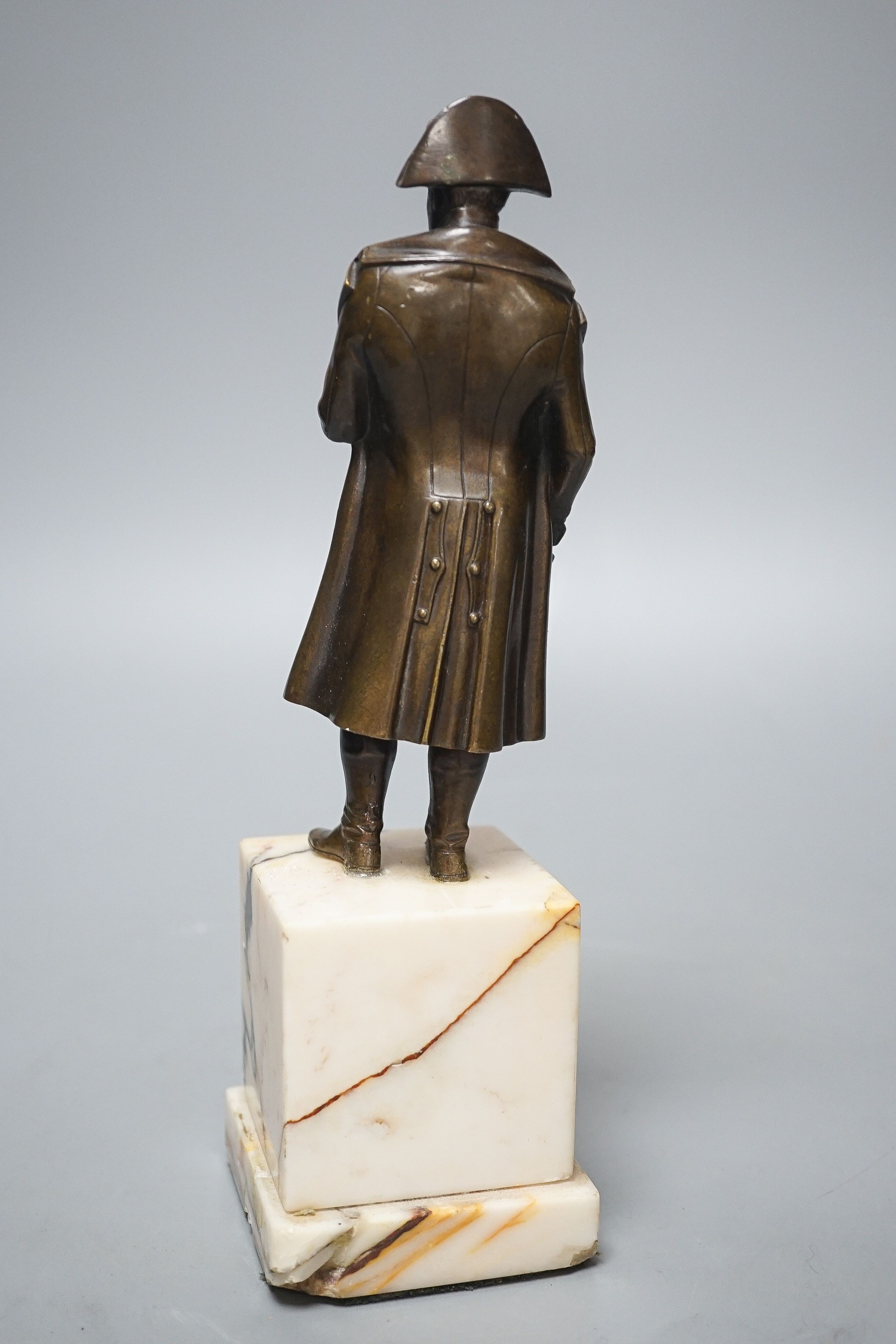 A bronze figure of Napoleon on marble base and two related prints ‘Porto Ferrajo’ and ‘Grand Entry of the Allied Sovereigns into Paris’ bronze 24cm tall